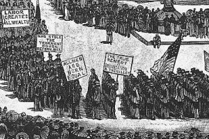 Workers carried signs in the first Labor Day parade that highlighted their concerns in the Gilded Age.
